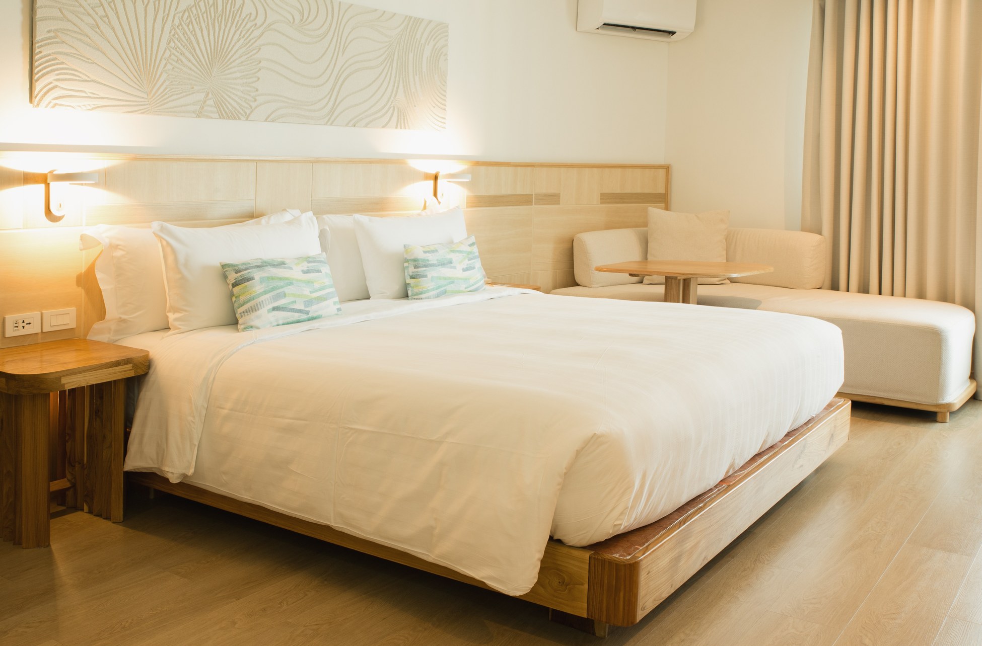 Hotel room with neutral colours and wood